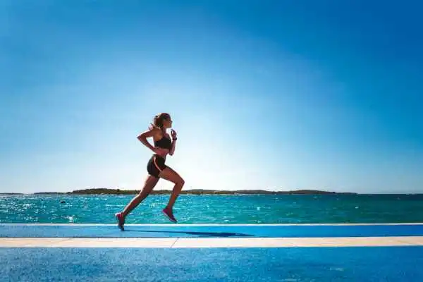 Woman running showing strong leg muscle Headingley
